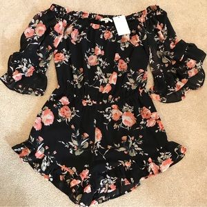 Eesome NWT floral romper. Pretty, flowing sleeves withe flattering ruffles